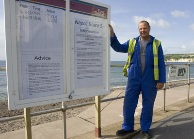 Salvage contractors DRS - signs updating on the condition of the beach.